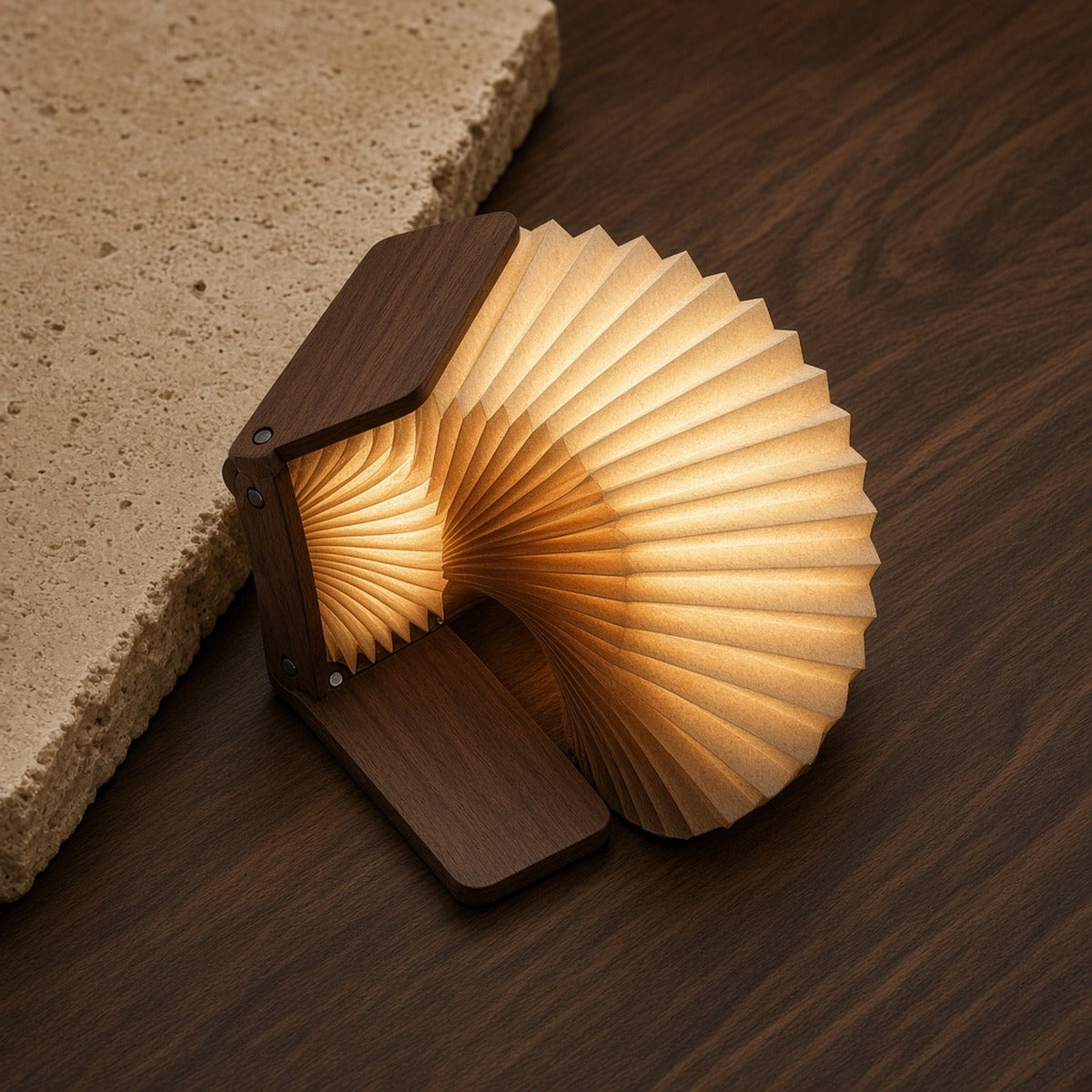 Aetheris Atelier Magnetic Folding Walnut and Warm-LED Accordion Sculptural Book Light opened 360 degrees into glowing sculptural fan
